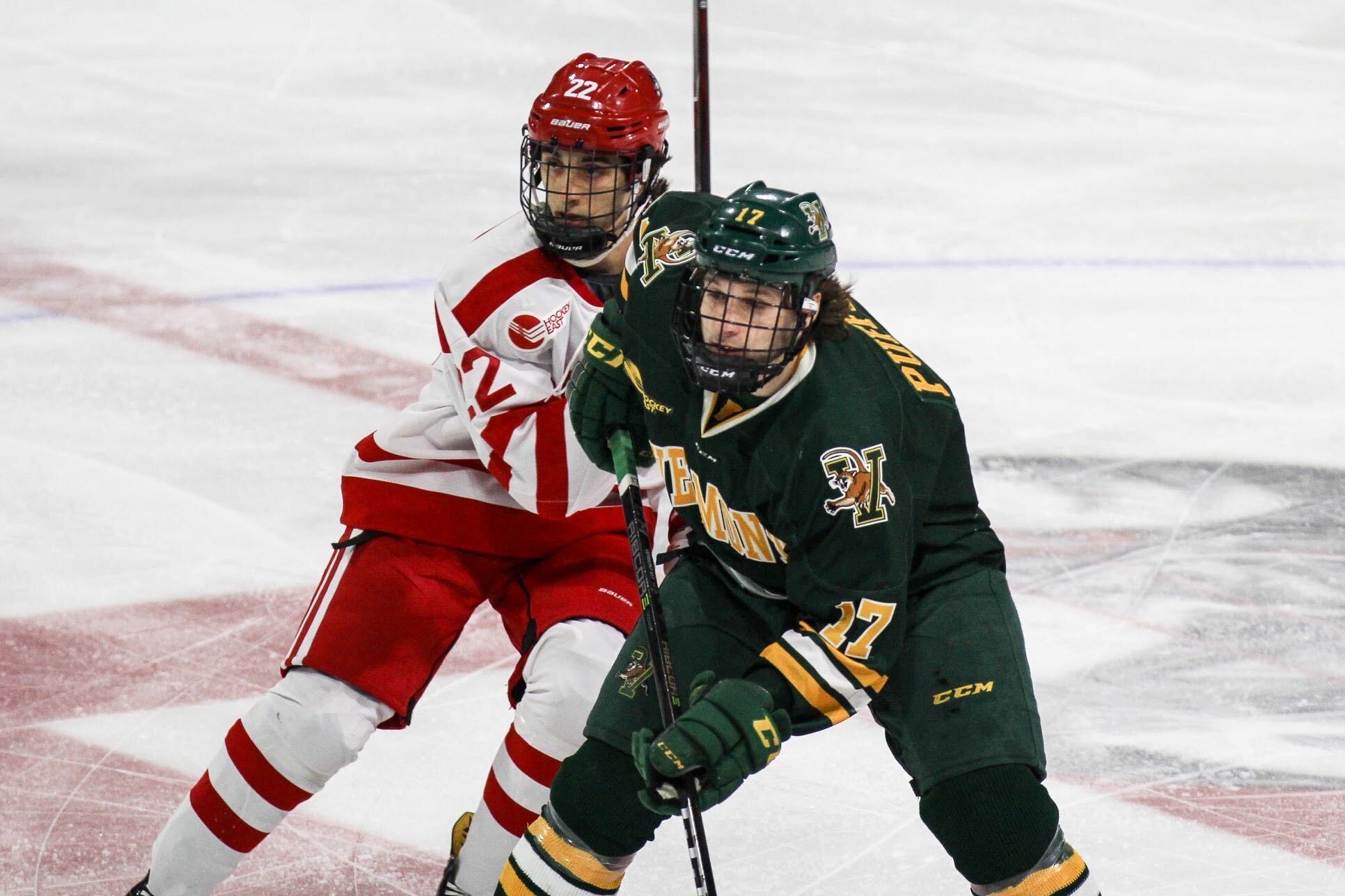 Two players battle for position on the ice